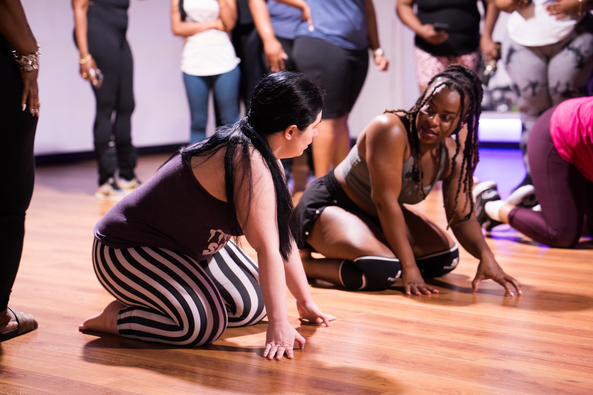 Coco teaching movement; image represents the class experience, not a confirmed Dallas event