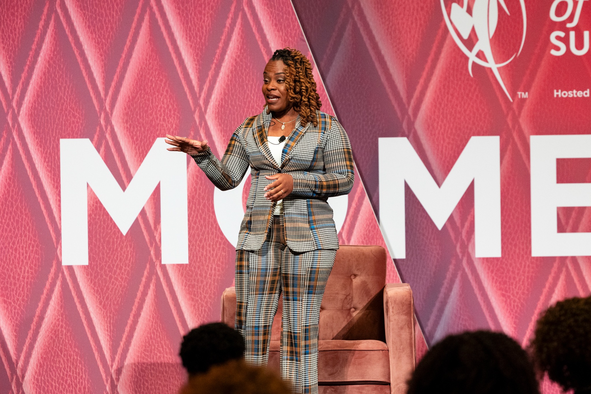 Coco speaking to the audience at the Women of Power Summit